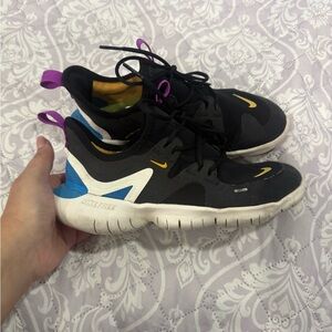 Nike Black and White Sneakers with Blue and Yellow Accents